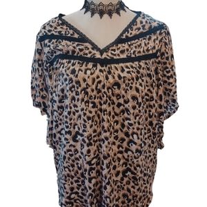 Leopard top blouse animal print,  flowy with black trim. Short sleeves. V-neck